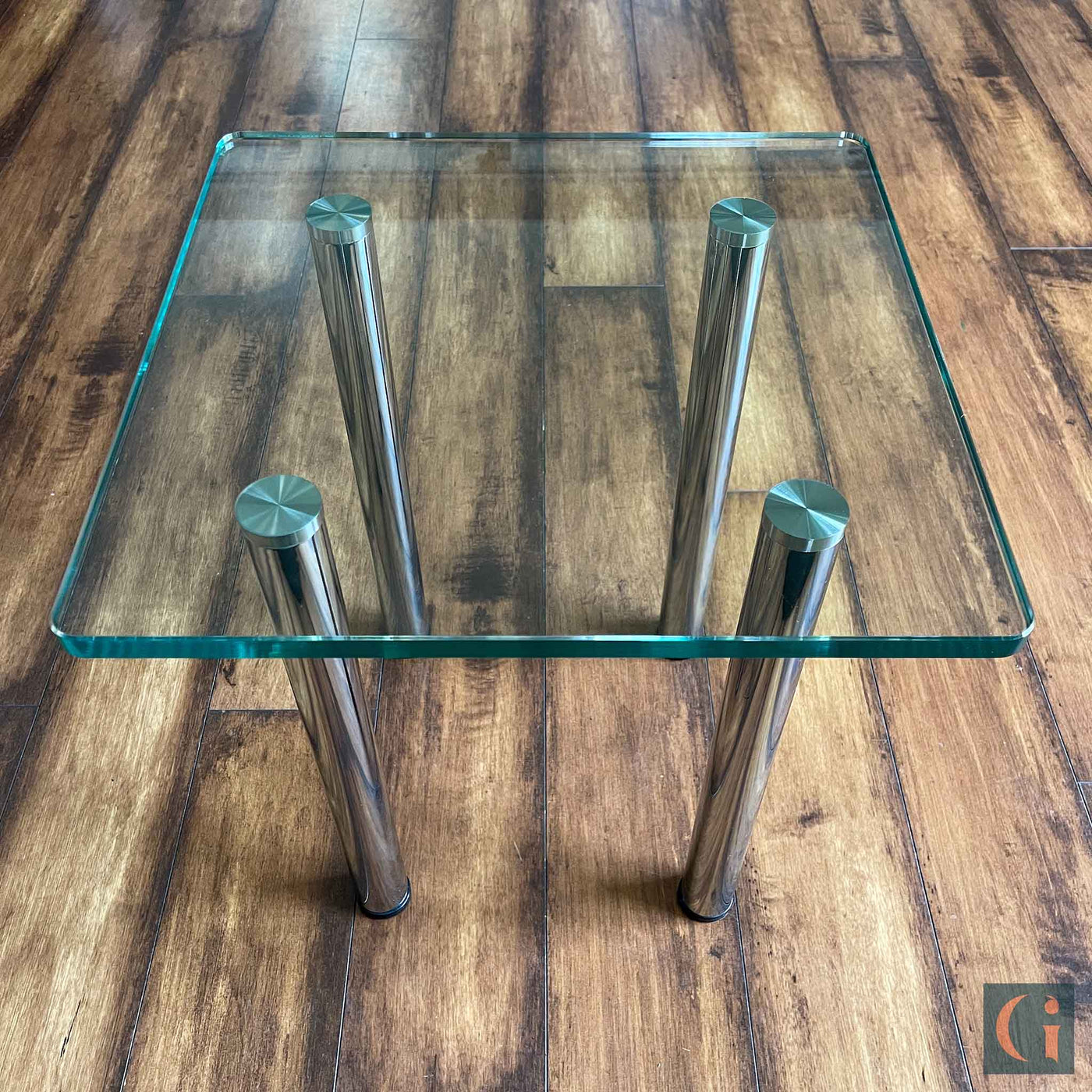 Toughened Clear Glass Side Table, 15mm thickness with polished edges and radius corners. Stainless-Steel UV Bonded Table legs. Modern & contemporary glass side table, coffee table, shelves, furniture & interiors products Ireland.