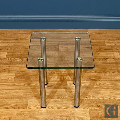 Toughened Clear Glass Side Table, 15mm thickness with polished edges and radius corners. Stainless-Steel UV Bonded Table legs. Modern & contemporary glass side table, coffee table, shelves, furniture & interiors products Ireland.