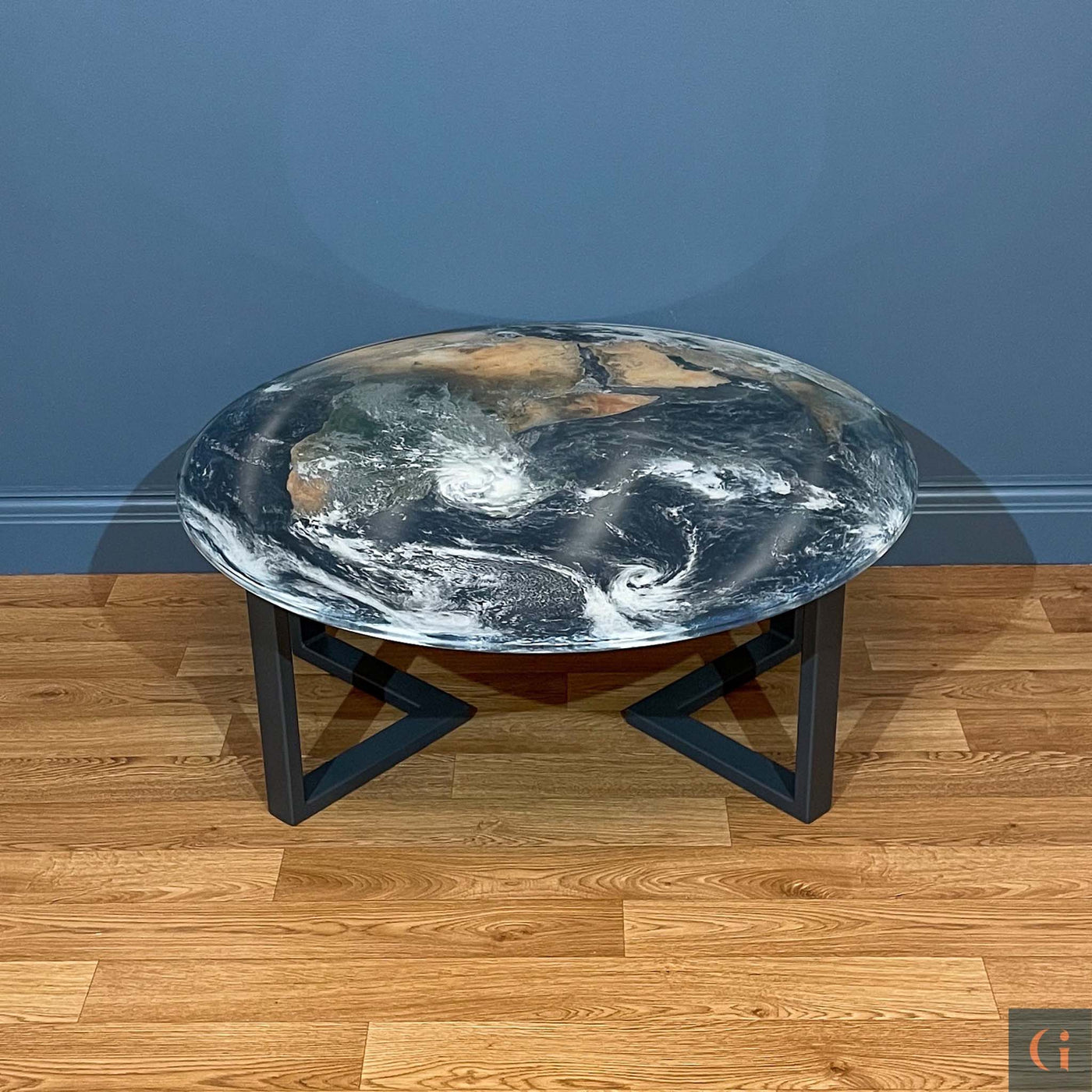 Front view of Earth Design Digitally Printed Toughened Glass Circle Coffee Table top with powder coated steel table base. Modern & colourful coffee table design. Contemporary Glass tables, shelves, furniture & interior products Ireland.