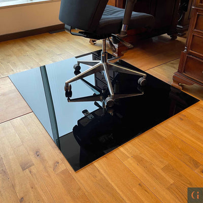 Toughened Glass Chair Mat, black ceramic glass, 6mm thickness, polished edges. Protect wood, carpet or tile office floor and increase ease of movement on office chair casters. Home office desk essentials. Modern & Contemporary Glass floor mat, furniture and Glass interior products Ireland.