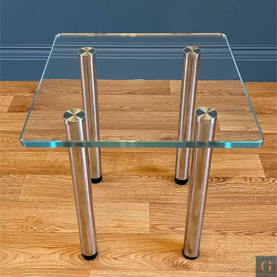 Toughened Ultra-Clear Glass Side Table, 15mm thickness with polished edges and radius corners. Stainless-Steel UV Bonded Table legs. Modern & contemporary glass side table, coffee table, shelves, furniture & interiors products Ireland.