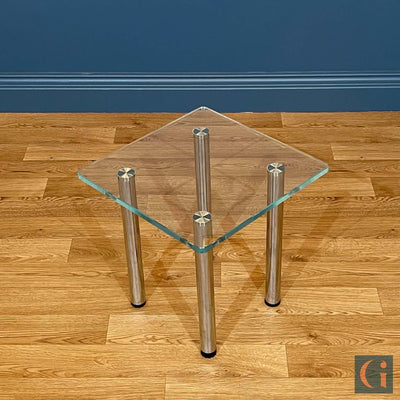 Toughened Ultra-Clear Glass Side Table, 15mm thickness with polished edges and radius corners. Stainless-Steel UV Bonded Table legs. Modern & contemporary glass side table, coffee table, shelves, furniture & interiors products Ireland.