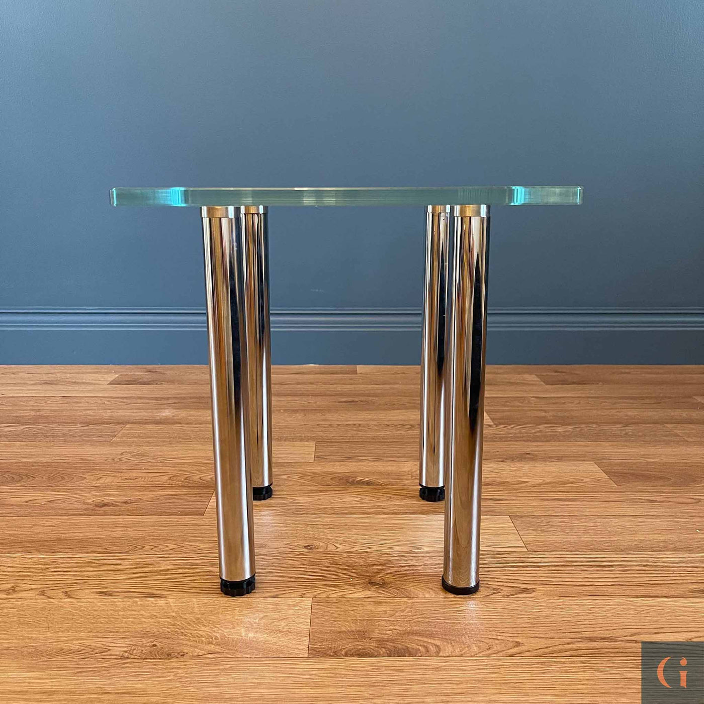 Toughened Ultra-Clear Glass Side Table, 15mm thickness with polished edges and radius corners. Stainless-Steel UV Bonded Table legs. Modern & contemporary glass side table, coffee table, shelves, furniture & interiors products Ireland.