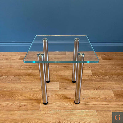 Toughened Ultra-Clear Glass Side Table, 15mm thickness with polished edges and radius corners. Stainless-Steel UV Bonded Table legs. Modern & contemporary glass side table, coffee table, shelves, furniture & interiors products Ireland.